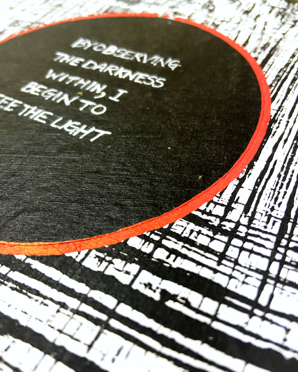 The Darkness — a black circle with a red rim on a black-and-white textured ground, lettered: observing the darkness within, I begin to see the light